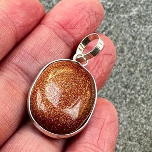 NWOT Goldstone Oval Dainty Pendant Silver Bezel Sparkling Copper Brown Glass